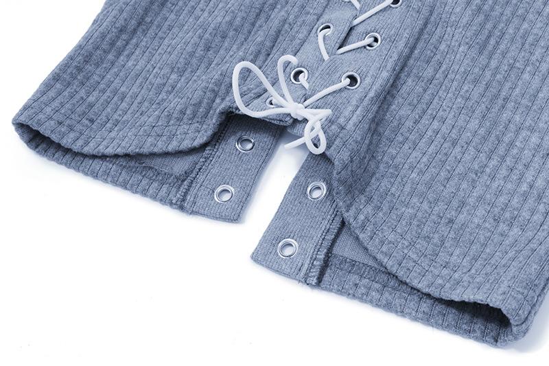 Long sleeve hollow out lace up textured round neck top