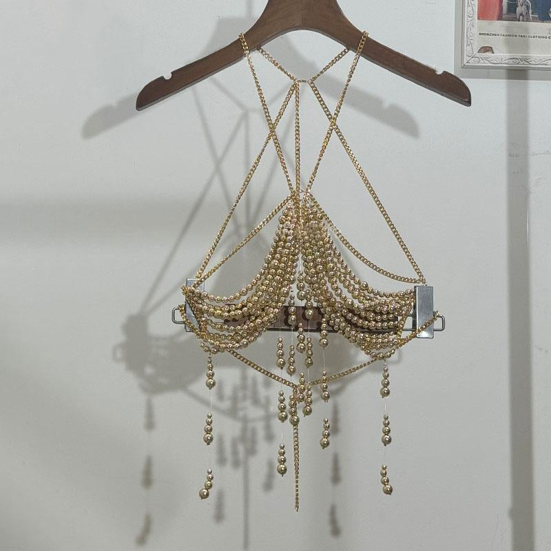 Haut dos nu ajouré avec chaîne en métal et perles 