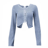 Long sleeve hollow out lace up textured round neck top