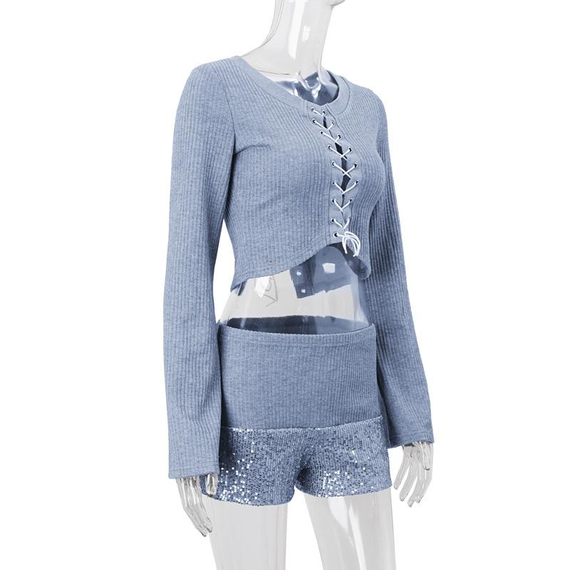 Long sleeve hollow out lace up textured round neck top