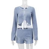 Long sleeve hollow out lace up textured round neck top