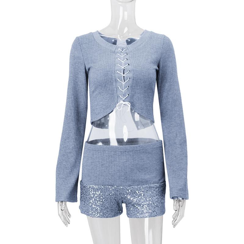 Long sleeve hollow out lace up textured round neck top
