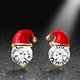 Boucles d'oreilles à tige en strass avec décoration de chapeau de Père Noël