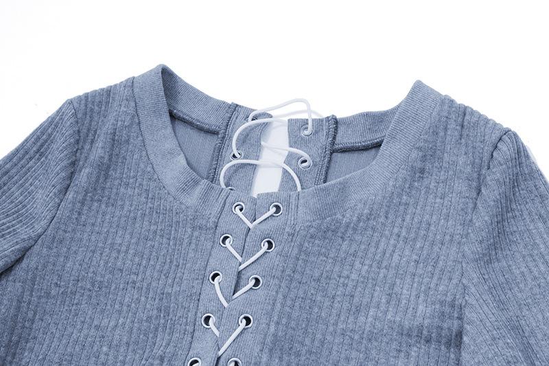 Long sleeve hollow out lace up textured round neck top