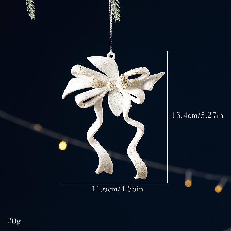 Décoration de sapin de Noël avec nœud blanc