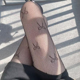 Medias de rejilla con estampado de lazo 
