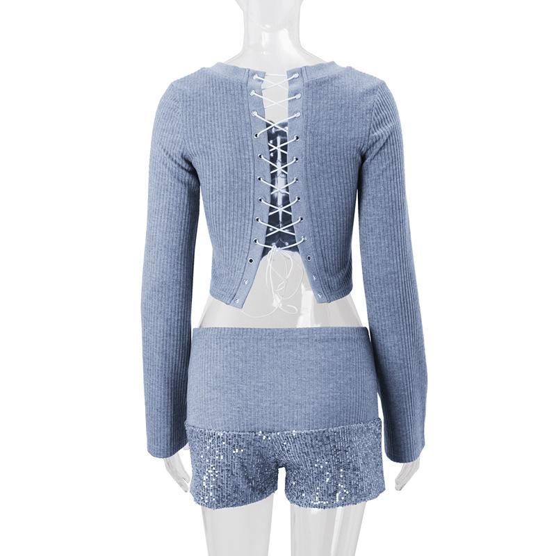 Long sleeve hollow out lace up textured round neck top