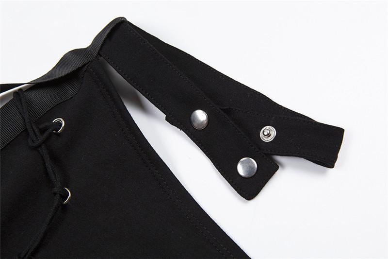 Haut asymétrique à manches longues et boutons avec boucle irrégulière 