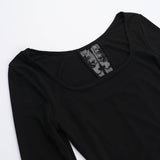Top de manga larga con cuello redondo y estampado cruzado 