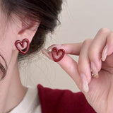 Pendientes con colgante de perla sintética con forma de corazón y lazo
