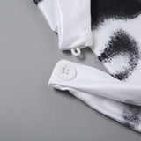 Haut dos nu imprimé avec ourlet en dentelle et boutons licou 