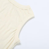 Top liso sin mangas con cuello redondo, irregular y calado 