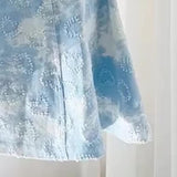 Mini-robe caraco contrastée en denim à col en V et perles 
