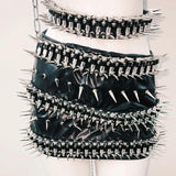 Conjunto de minifalda con cadena de metal y apliques de remaches de anillo en O de cuero PU 