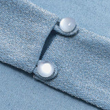 Top sin espalda, cuello vuelto, botones y lazo tipo halter 