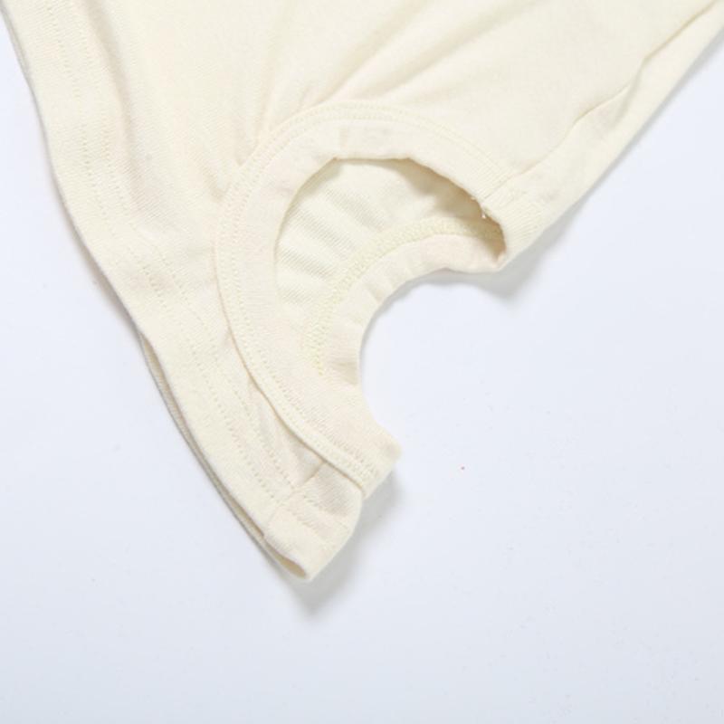 Top liso sin mangas con cuello redondo, irregular y calado 